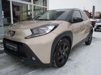 Gebraucht Toyota Aygo X Basis 72 PS (52 kW) 2023 Ginger beige metallic/ night sky black SUV