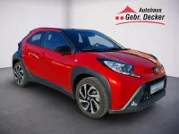 Gebraucht Toyota Aygo X Pulse 72 PS (52 kW) 2023 Chili red perleffekt/ night sky black SUV