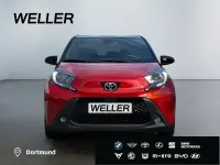 Gebraucht Toyota Aygo Team 72 PS (52 kW) 2024 Chili red / dach black mica (rot) Kleinwagen
