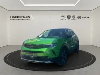 Gebraucht Opel Mokka Elegance 101 PS (74 kW) 2023 Matcha green/ikone gruen (metallic) SUV