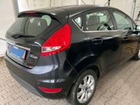 Gebraucht Ford Fiesta Ghia 101 PS (74 kW) 2009 Pantherschwarz metallic Kleinwagen
