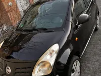 Gebraucht Nissan Pixo 68 PS (50 kW) 2010 Schwarz Kleinwagen