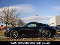 Gebraucht Porsche 992 385 PS (283 kW) 2023 Tiefschwarzmetallic Coupé