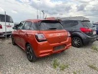 Gebraucht Suzuki Swift Comfort+ 83 PS (61 kW) 2024 Flame orange pearl metallic Kleinwagen