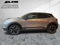 Gebraucht Opel Mokka-e Ultimate 100 kW (136 PS) 2022 Kontrast grau/quarz silber SUV
