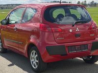 Second-hand Mitsubishi Colt Inform 75 CP (55 kW) 2008 Roșu Berlinǎ