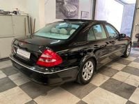 Second-hand Mercedes E320 Avantgarde 224 CP (164 kW) 2004 Negru Berlinǎ