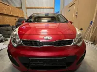 Gebraucht Kia Rio 90 PS (66 kW) 2012 Rot Limousine