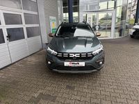 Gebraucht Dacia Sandero 101 PS (74 kW) 2024 Oxidgrün (metallic) Limousine