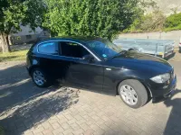Gebraucht BMW 116 122 PS (89 kW) 2009 Schwarz Kleinwagen