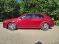 Gebraucht Mitsubishi Lancer 143 PS (105 kW) 2010 Rot Limousine