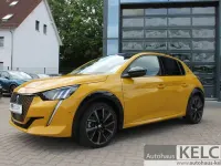 Gebraucht Peugeot e-208 GT 100 kW (136 PS) 2023 Faro gelb (metallic) Kleinwagen