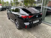 Gebraucht BMW iX2 M Sport 230 kW (313 PS) 2025 Schwarz sapphire metallic SUV