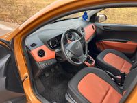 Gebraucht Hyundai i10 87 PS (63 kW) 2014 Orange Kleinwagen