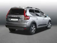 Gebraucht Dacia Jogger Expression 141 PS (103 kW) 2025 Dolomitgrau (grau) Van / Kleinbus