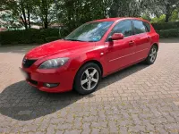 Używany Mazda 3 105 KM (77 kW) 2006 Czerwony Sedan/Limuzyna