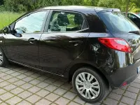 Używany Mazda 2 Dynamic 103 KM (75 kW) 2009 Purpurowy Hatchback