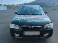 Usata Mazda 323 88 CV (64 kW) 1998 Verde Berlina