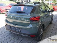 Gebraucht Dacia Sandero Expression 91 PS (66 kW) 2024 Safarigrüngrau metallic Kleinwagen