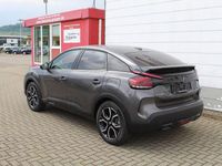 Gebraucht Citroën e-C4 Shine 100 kW (136 PS) 2023 Platinumgrau Limousine