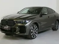Gebraucht BMW X6 M50 Shadowline 530 PS (389 kW) 2023 Manhatten met. (braun) SUV