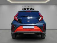 Gebraucht Toyota Aygo X Pulse 72 PS (52 kW) 2023 Chili red (3u4)/ black mica (2 SUV