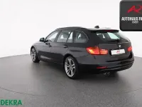 Gebraucht BMW 330 Comfort Edition 258 PS (189 kW) 2014 Black sapphire Kombi