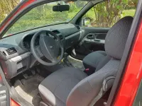 Używany Renault Clio II Campus 58 KM (42 kW) 2009 Czerwony Sedan/Limuzyna