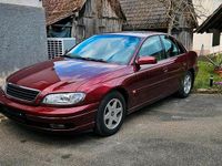 Second-hand Opel Omega 170 CP (125 kW) 2000 Roșu Berlinǎ