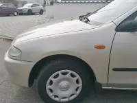 Second-hand Mazda 323 88 CP (64 kW) 1996 Bej Berlinǎ