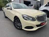 Używany Mercedes E200 136 KM (100 kW) 2016 Żółty Sedan/Limuzyna