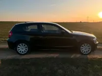 Gebraucht BMW 116 122 PS (89 kW) 2009 Schwarz Kleinwagen