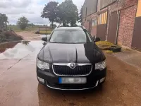 Używany Skoda Superb 105 KM (77 kW) 2012 Czarny Kombi