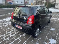 Gebraucht Nissan Pixo 68 PS (50 kW) 2010 Schwarz Kleinwagen
