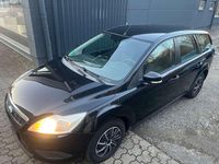 Gebraucht Ford Focus 90 PS (66 kW) 2010 Pantherschwarz metallic Kombi