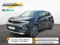 Gebraucht Opel Mokka-e Elegance 100 kW (136 PS) 2023 Diamant schwarz/karbon schwarz SUV