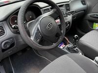Second-hand Kia Rio 97 CP (71 kW) 2011 Negru Hatchback