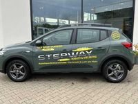 Gebraucht Dacia Sandero Expression 91 PS (66 kW) 2024 Safarigrüngrau Kleinwagen