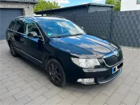 Używany Skoda Superb 170 KM (125 kW) 2012 Czarny Kombi
