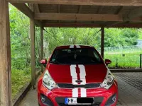 Gebraucht Kia Rio 109 PS (80 kW) 2012 Rot Limousine