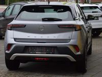 Gebraucht Opel Mokka-e Elegance 100 kW (136 PS) 2022 Kontrast grauquarz silber (metallic) SUV