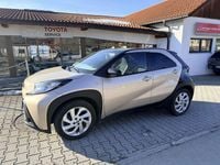 Gebraucht Toyota Aygo Pulse 72 PS (52 kW) 2022 Ginger beige (4u9)/ black Kleinwagen