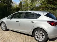 Second-hand Opel Astra 95 CP (69 kW) 2012 Argintiu Berlinǎ