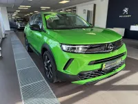 Gebraucht Opel Mokka Elegance 101 PS (74 kW) 2024 Lackierung matcha green/typ au SUV