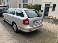 Second-hand Skoda Octavia Ambiente 105 CP (77 kW) 2010 Argintiu Break