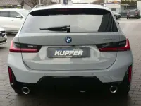 Gebraucht BMW 330e Performance 292 PS (214 kW) 2024 Brooklyngrau Kombi