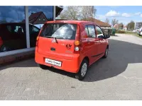 Gebraucht Daihatsu Cuore 69 PS (50 kW) 2010 Rot Kleinwagen
