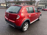 Second-hand Dacia Sandero Stepway 88 CP (64 kW) 2011 Roșu Berlinǎ
