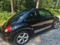 Gebraucht VW New Beetle 102 PS (75 kW) 2010 Schwarz Kleinwagen