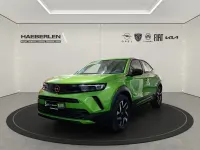 Gebraucht Opel Mokka Elegance 101 PS (74 kW) 2024 Lackierung matcha green/typ aussenverkle (metallic) SUV
